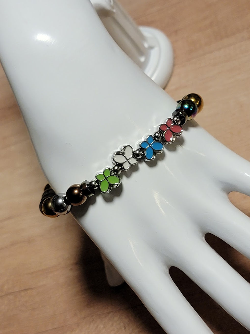 Handmade beaded bracelet with colorful butterfly charms