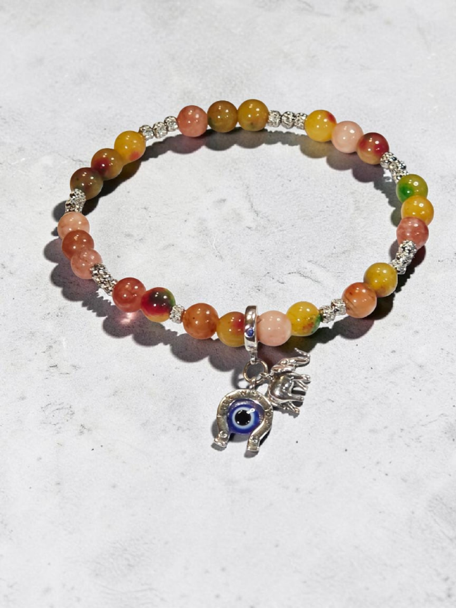 Vibrant beaded stretch bracelet with evil eye charm