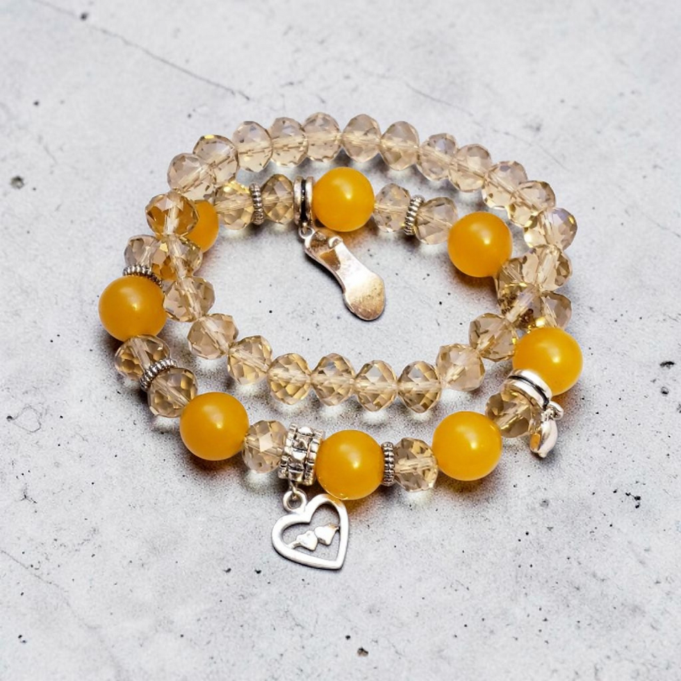 Double-wrap bracelet with clear and yellow beads, silver charms