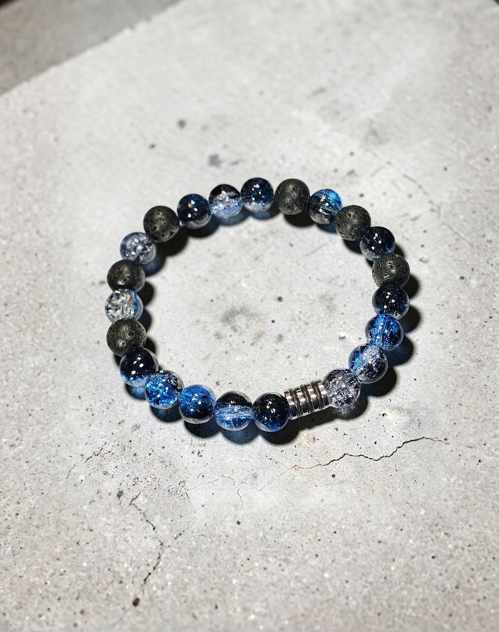 Blue and black beaded bracelet with textured stone