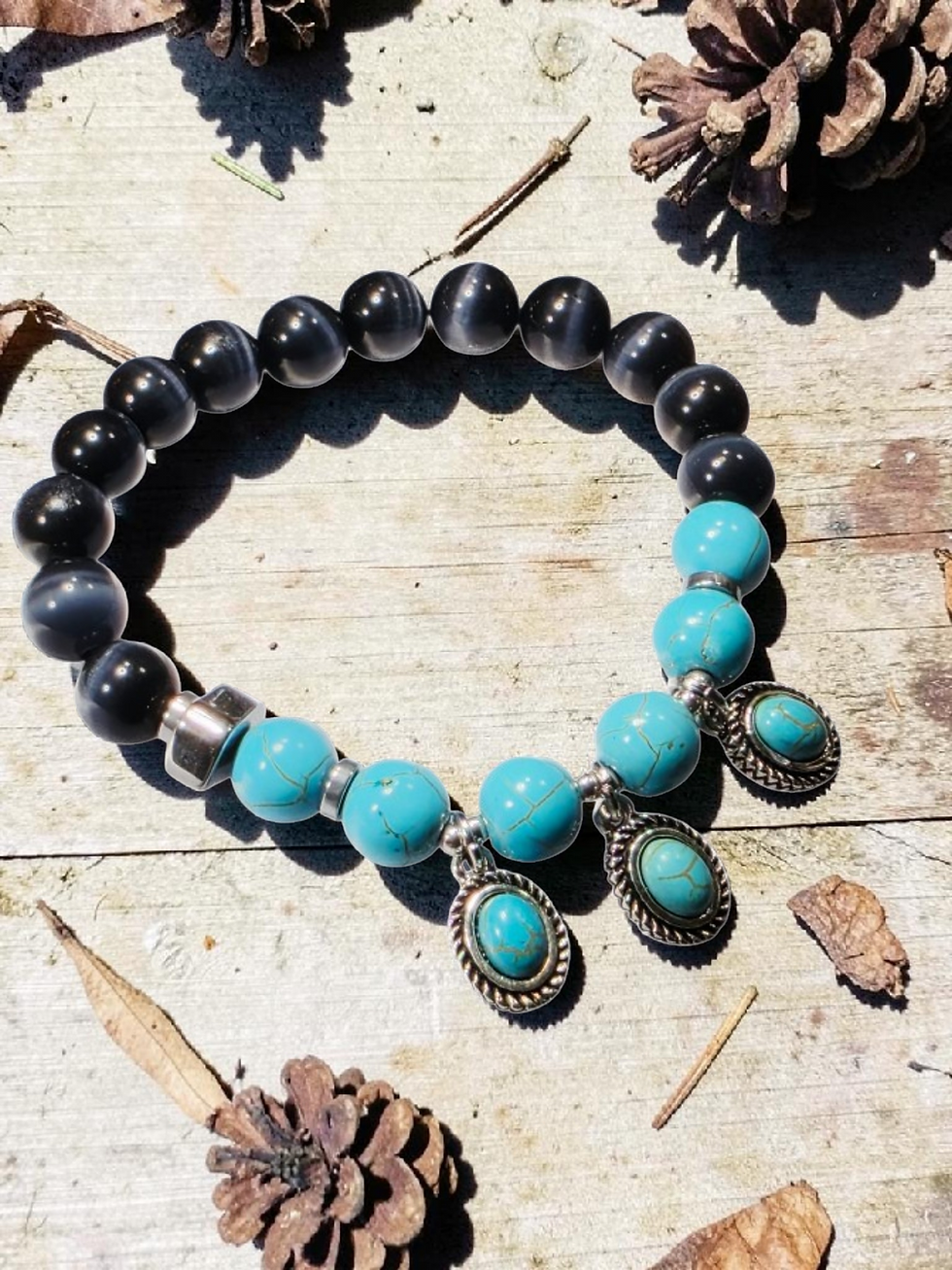 Thumbnail: Beaded bracelet with black and turquoise beads, silver charms