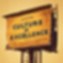An old and worn billboard sign stating "Culture of Excellence" that has seen better days.