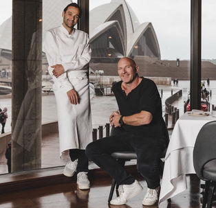 Chefs Matt Moran and Daniel Humm together at Aria in front of the Sydney Opera House