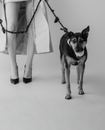 A black and white photo of Isabella and her dog