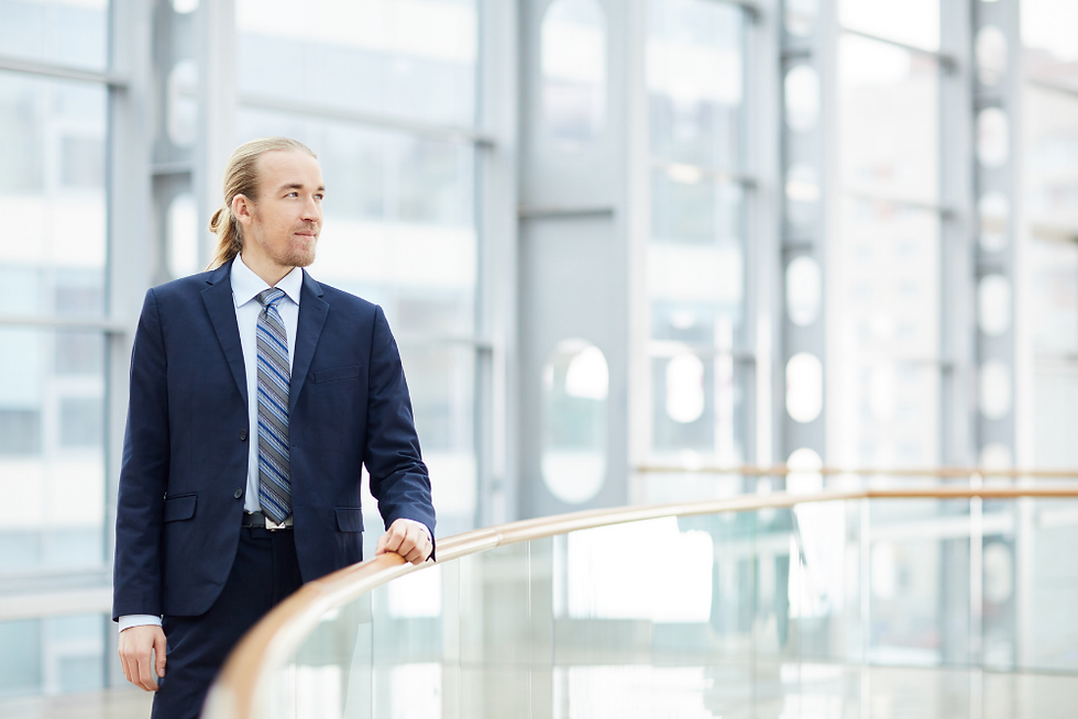 Young professional standing in corporate building