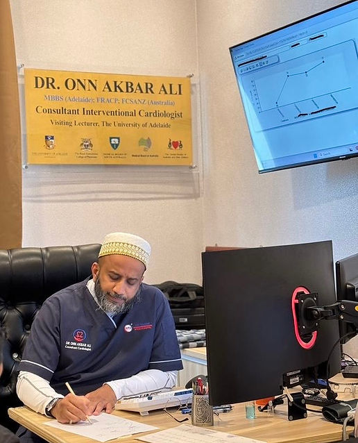 Dr Onn at his desk