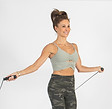 Woman over 50 doing jump rope workout to improve heart health and coordination
