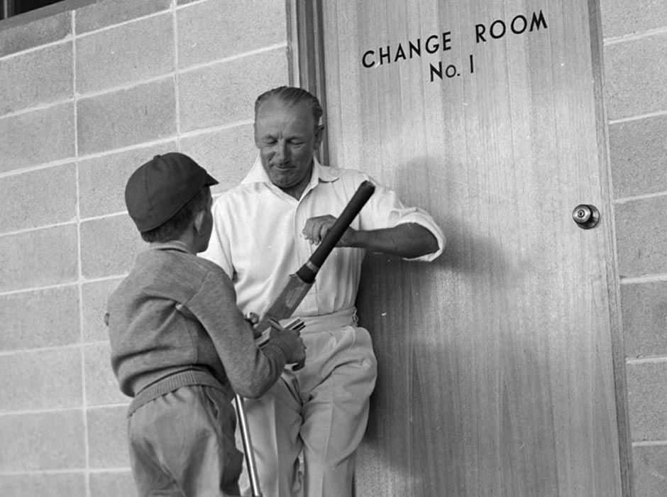 Donald Bradman and a child fan.jpeg