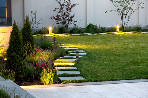 backyard of the mansion with a flowerbed