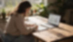 A female marketing leader at a Software SaaS company dressed in casual clothes sketches on a pad of paper, they have a laptop on the desk in their office, on the laptop screen are the words human, brands and resonate.