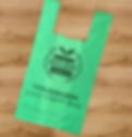 Eco compostable carrier bag with support your local butcher logo printed on
