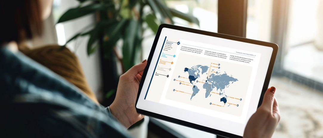 Lady in corporate office looks at Cubico ESG Report on tablet