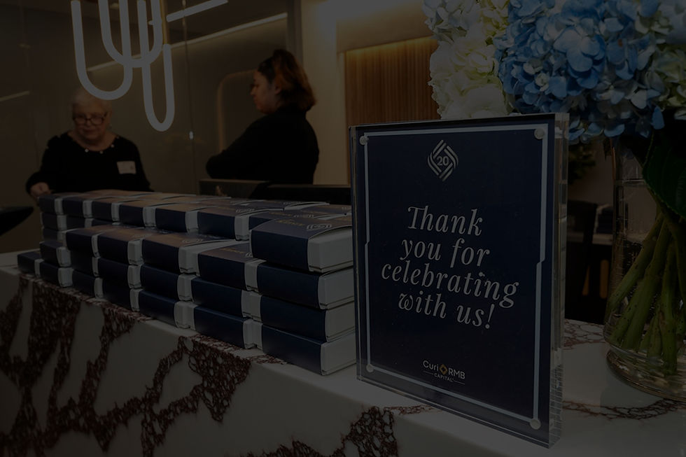 Corporate anniversary celebration in new Chicago office space with branded floral arrangements and elegant catering setup