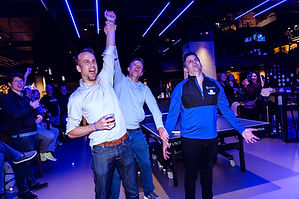 Clients celebrate ping pong tournament win at Customer Appreciation Event in Chicago.