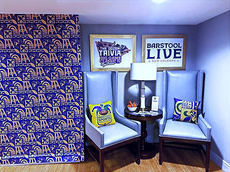 Barstool Sports branding on wall and chairs in VIP lounge at Super Bowl LIX.