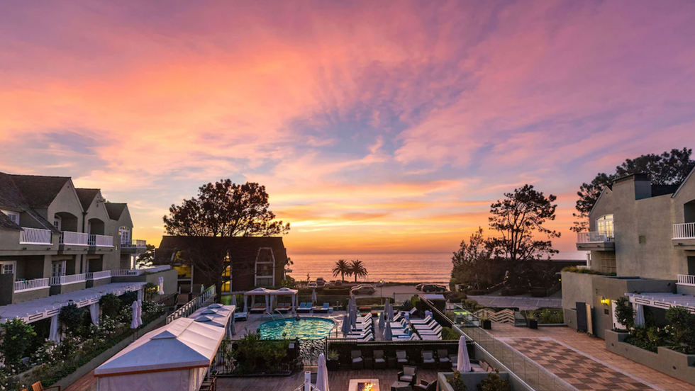 View from Del Mar hotel showing beautiful pink and blue sunset over the beach and ocean.