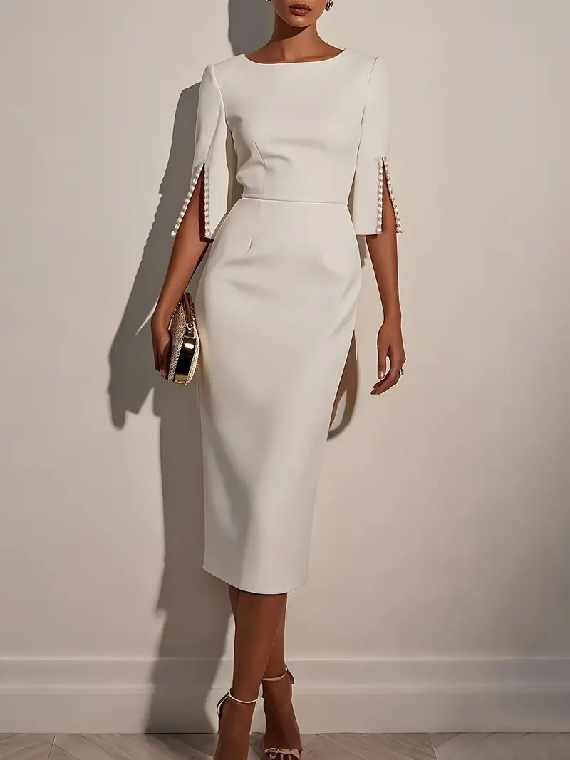 An elegant dress with short sleeves and beaded detailing, in a slim-fit cut.