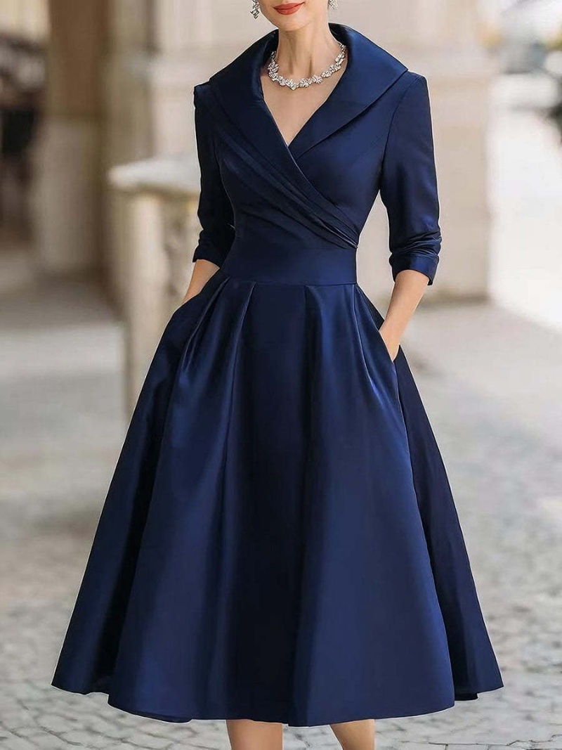 Thumbnail: Vintage-style flared midi dress with pockets and long sleeves