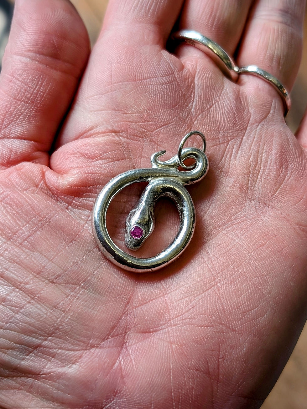 Thumbnail: Solid silver and ruby snake pendant.
