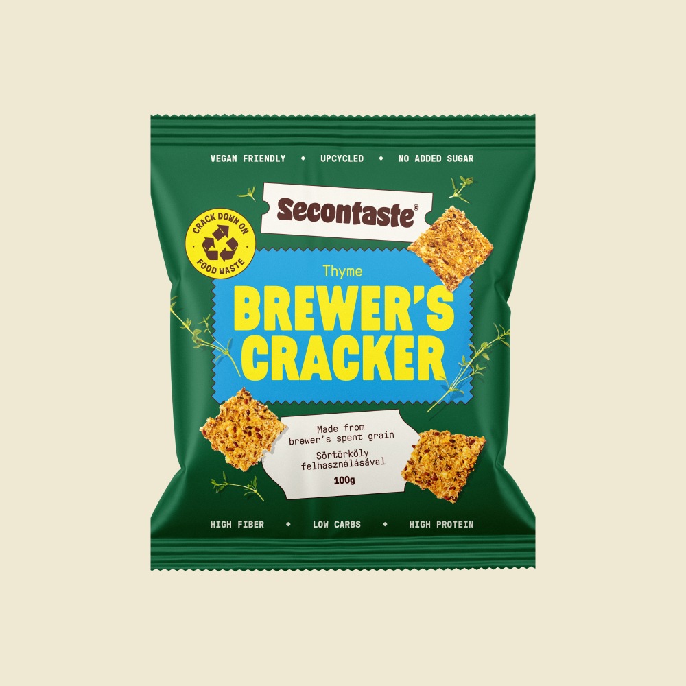 Green bag of Thyme flavoured Brewer's Crackers made from Spent Grain on a cream background.