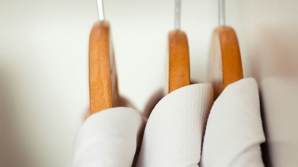 Smiling professional cleaner with cleaning tools