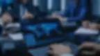 Image of person using laptop with global data flow map on screen