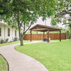 Outdoor event space with gazebo and winding path