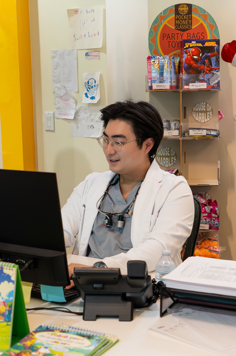 Smileland Dentistry for Kids Bakersfield California, dentist working.