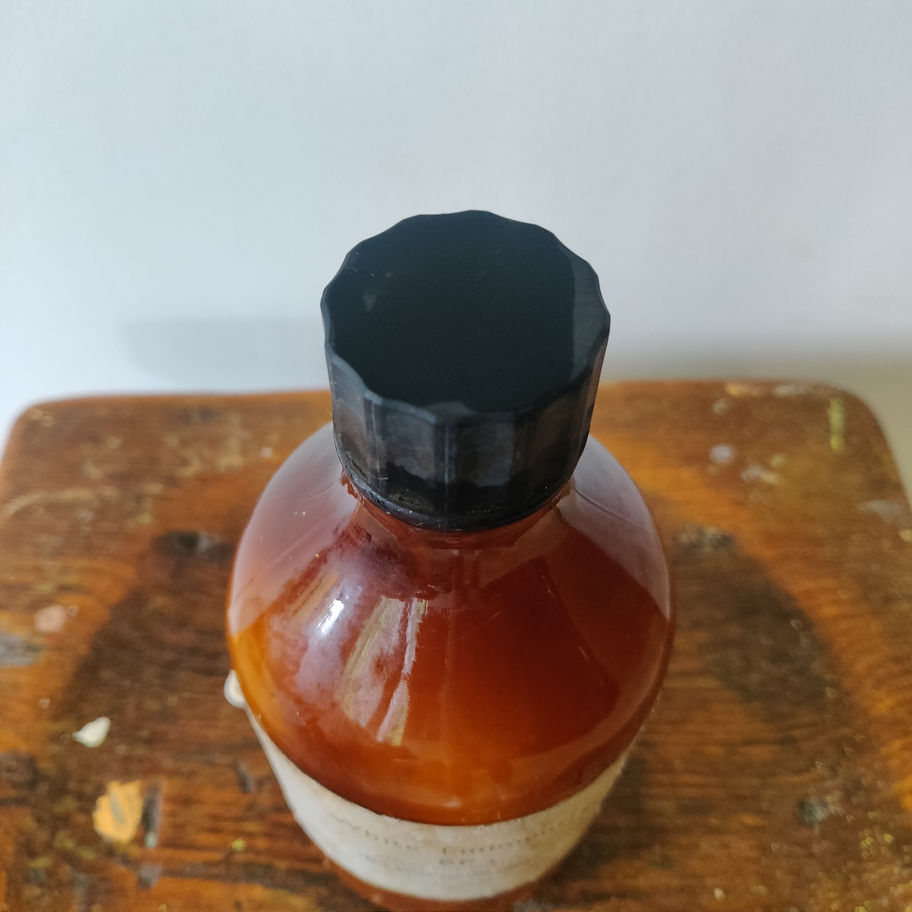 Vintage 1950s white liniment (some contents remain) apothecary/ chemist bottle