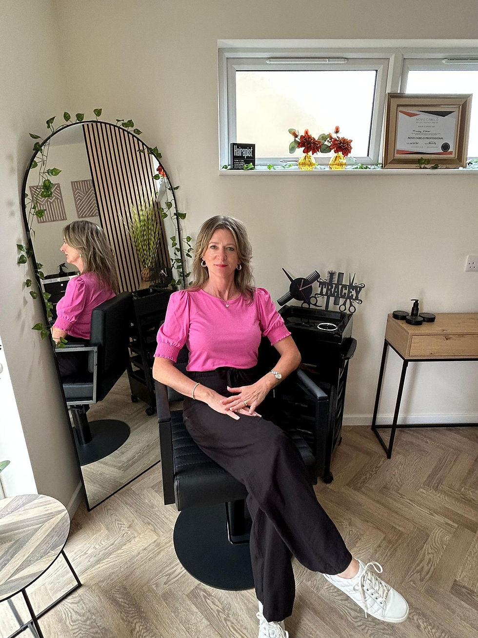 Tracey Fisher sitting in salon chair