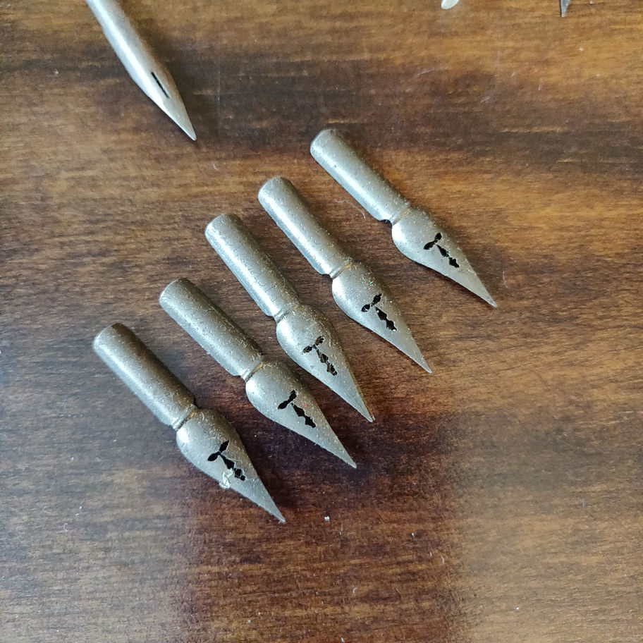 Vintage small tin skerfiercer? Fasteners full of George w Hughes pen nibs