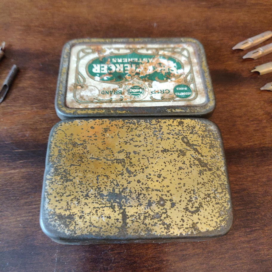Vintage small tin skerfiercer? Fasteners full of George w Hughes pen nibs