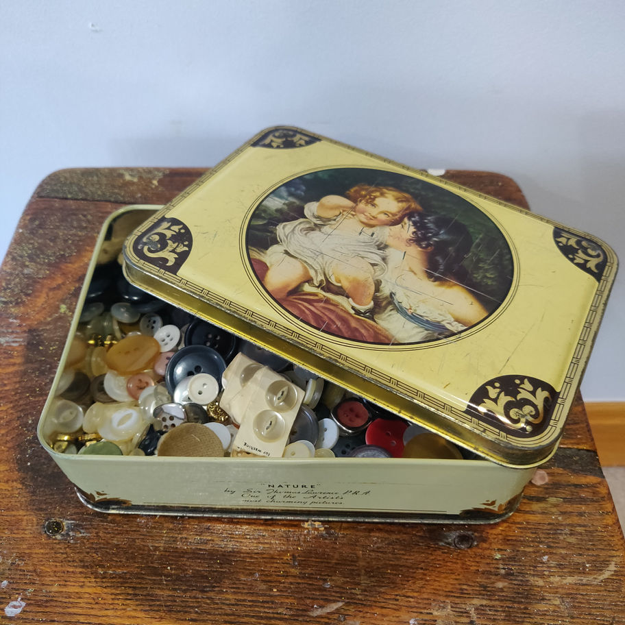 Vintage Thorns toffees lithograph tin full of vintage buttons