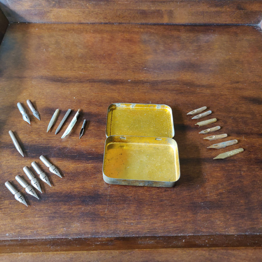 Vintage small tin skerfiercer? Fasteners full of George w Hughes pen nibs
