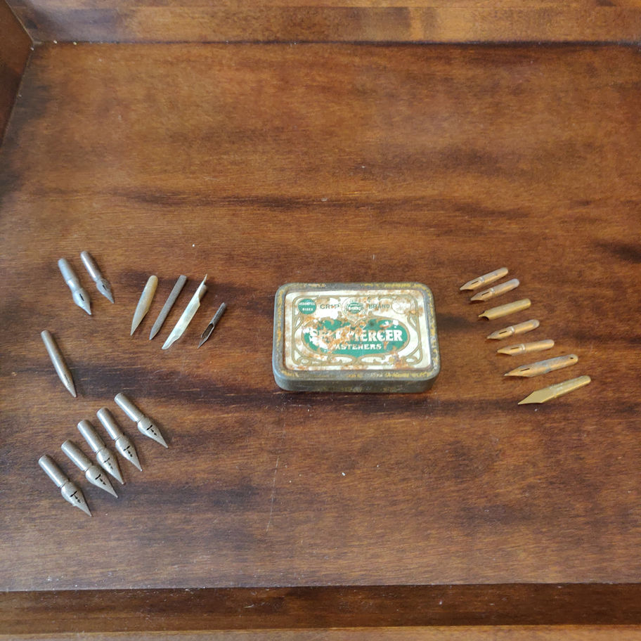 Vintage small tin skerfiercer? Fasteners full of George w Hughes pen nibs