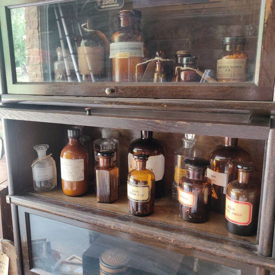 Vintage 1950s white liniment (some contents remain) apothecary/ chemist bottle