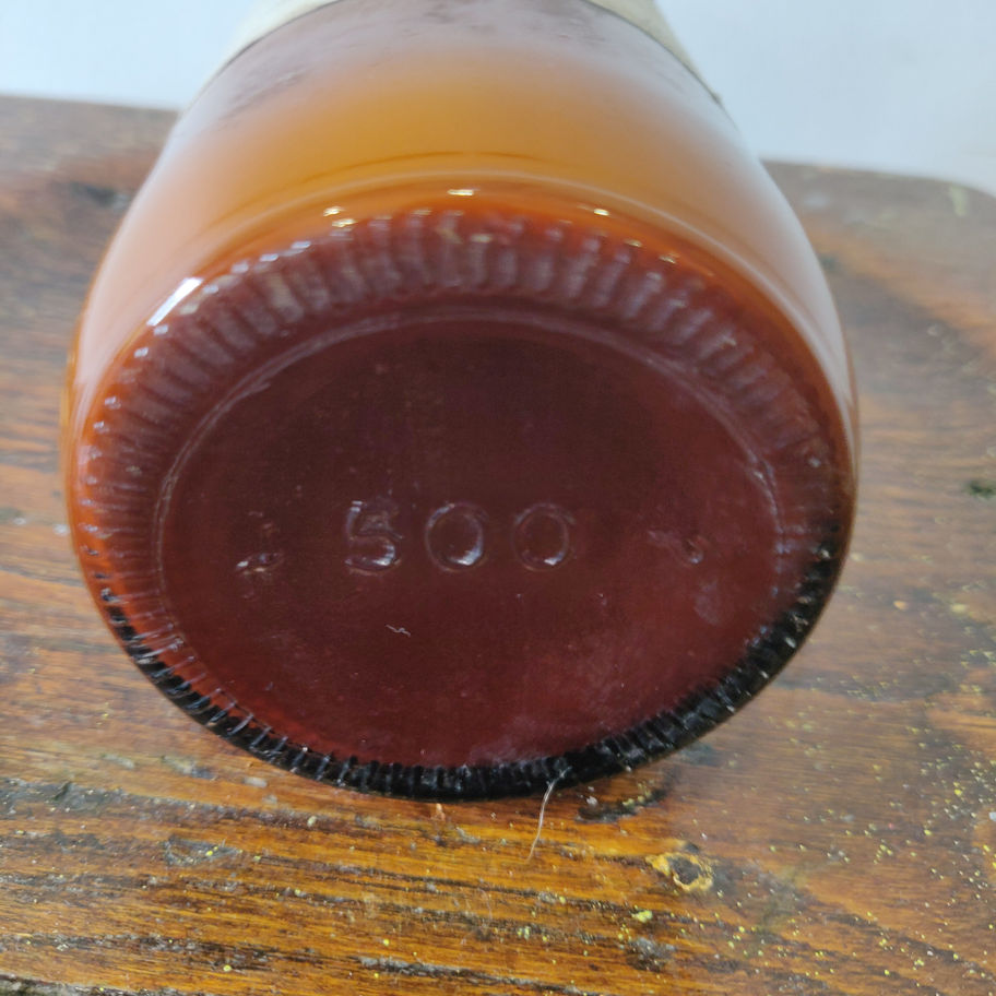 Vintage 1950s white liniment (some contents remain) apothecary/ chemist bottle