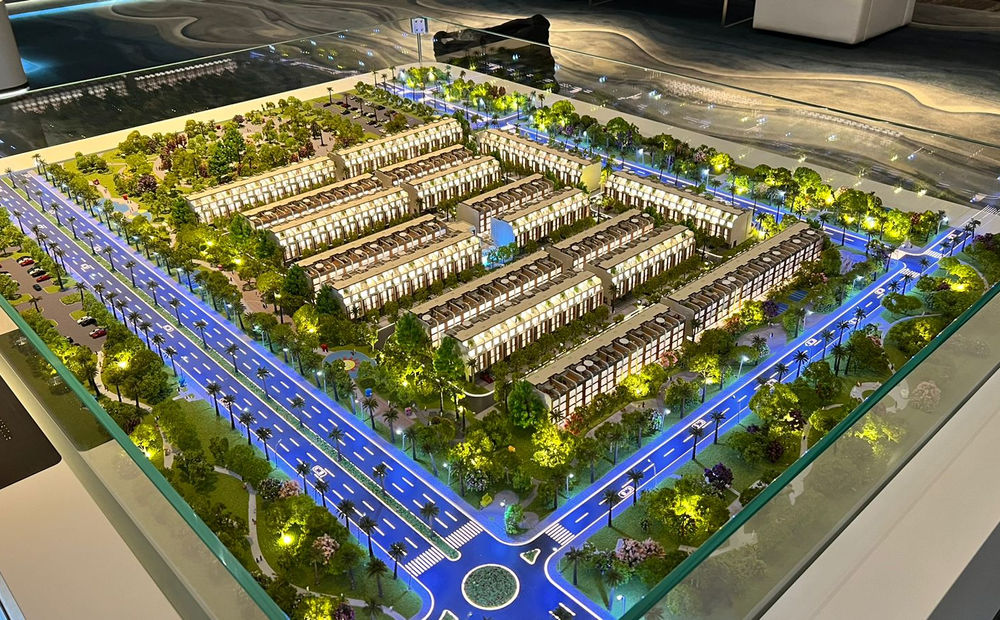 High angle view of a master plan architectural model displayed in a sales gallery