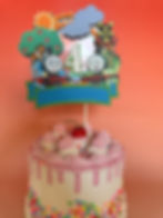 Thomas the Tank Engine cake topper featuring Thomas with a vibrant, colorful train design, perfect for a fun and festive birt