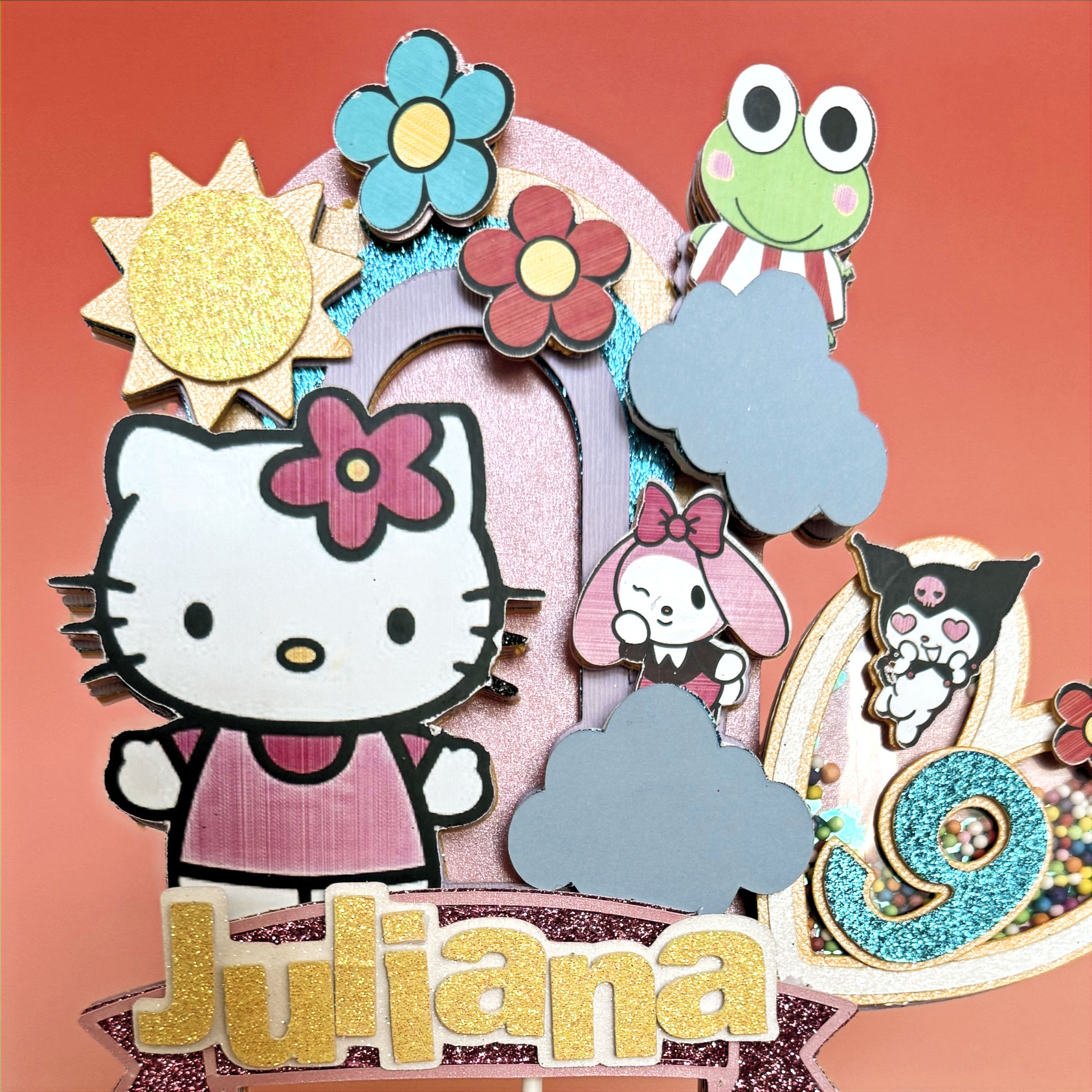 Hello Kitty cake topper featuring the adorable cat with a bow, in bright colors, perfect for adding a cute and playful touch