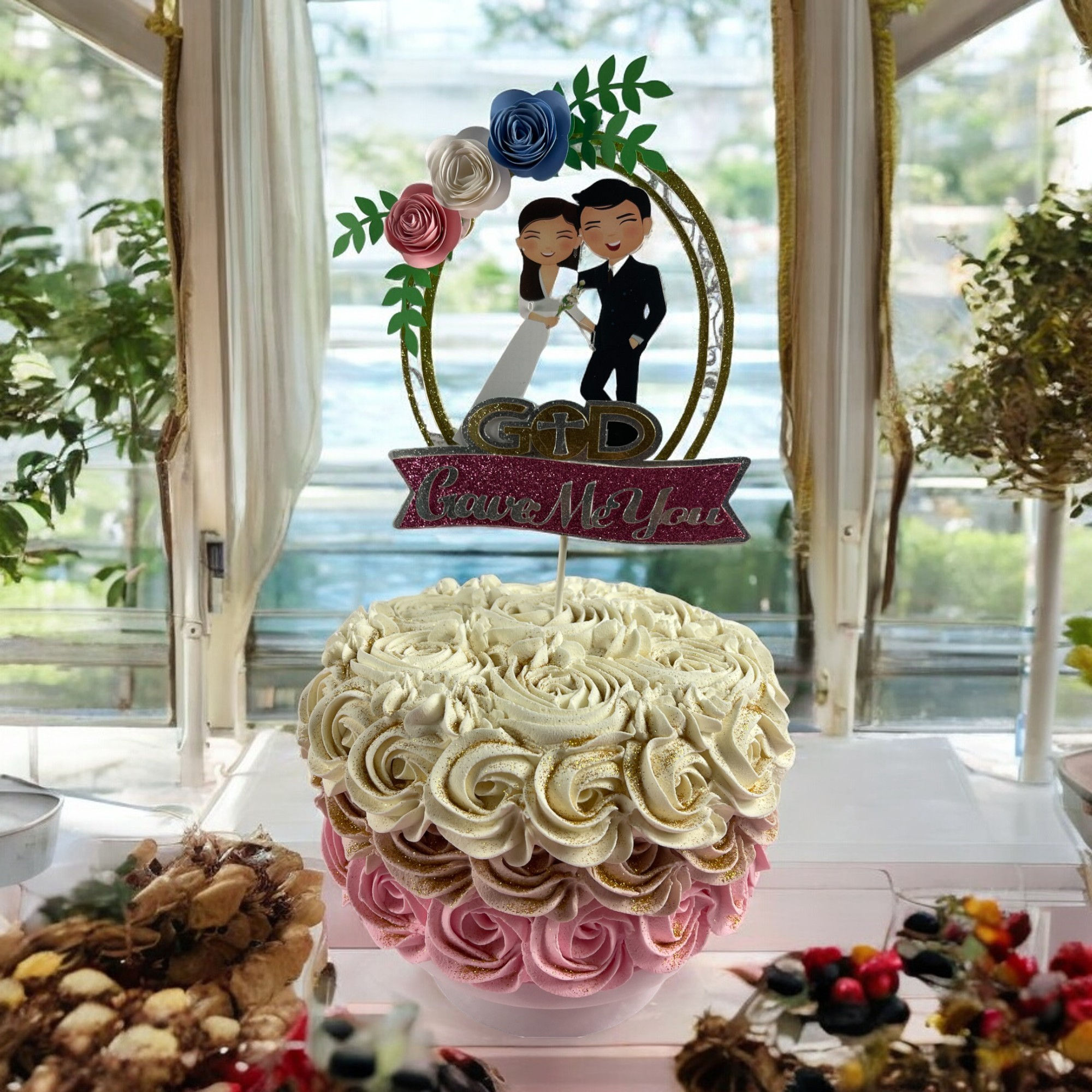 'God Gave Me You' wedding cake topper featuring cartoon bride and groom with floral accents, symbolizing divine love.