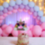 Unicorn themed multilayered multicolor cake topper with unicorn horn flowers