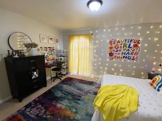 Student Bedroom w/ desk & full-sized bed. Furnished Apartments USF