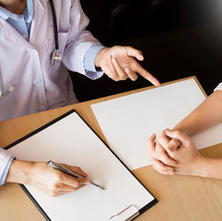Doctor discussing non-medication anxiety treatment with patient. 