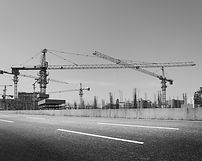 construction-site-with-cranes-against-blue-sky.jpg