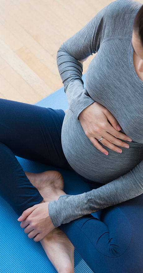 Pregnant Woman Practicing Yoga