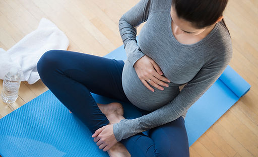 Pregnant Woman Practicing Yoga