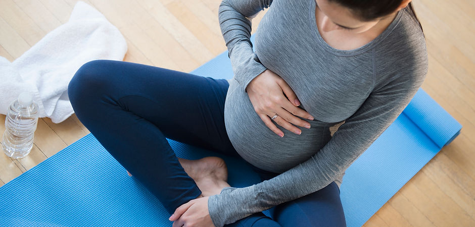Pregnant Woman Practicing Yoga