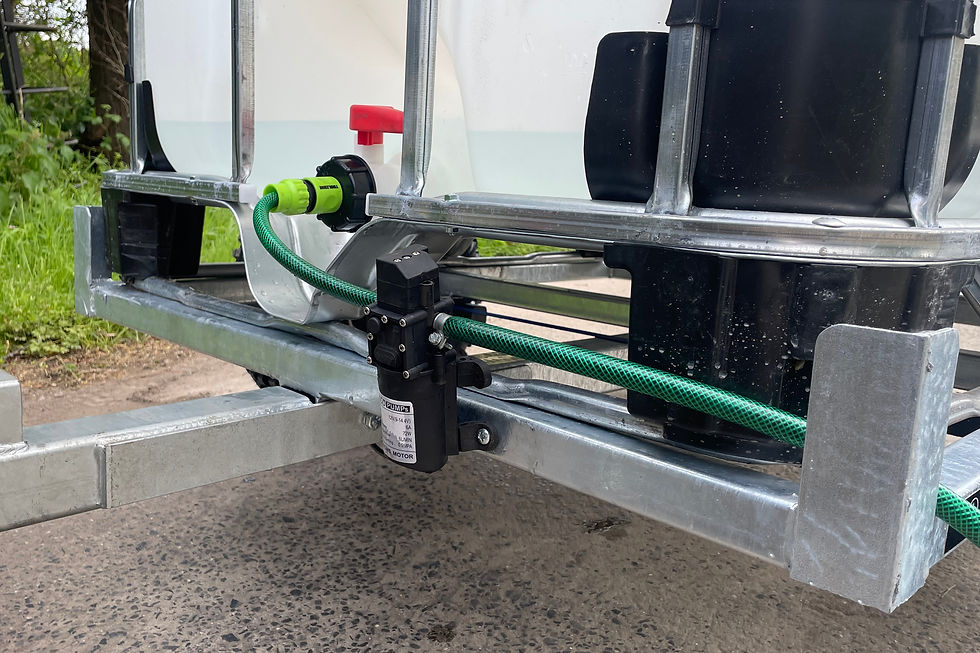 Thumbnail: Hose connection with green hose on the IBC Water Bowser