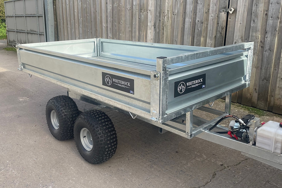 Thumbnail: ATV Flatbed Tipper With Sides against a fence